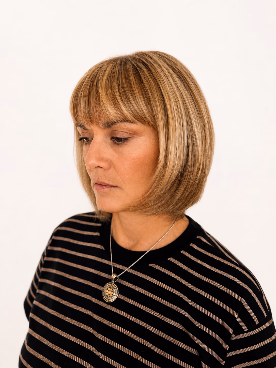 Blonde bob with a soft fringe and gentle graduation at the back.