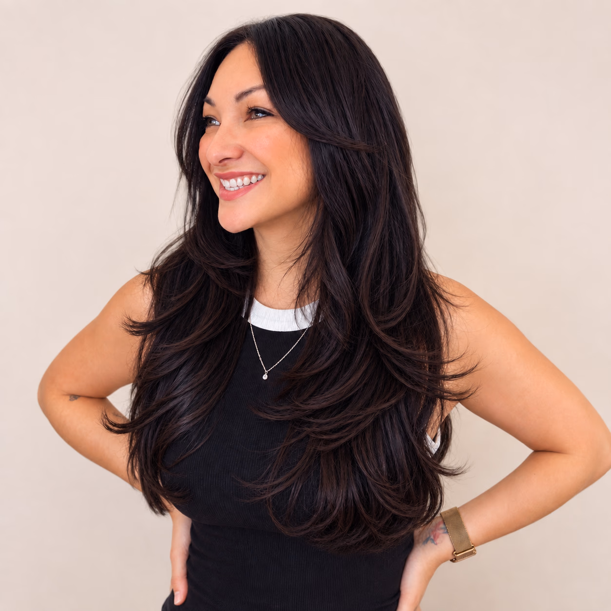 Long layers cut for movement, styled with a soft blowout.