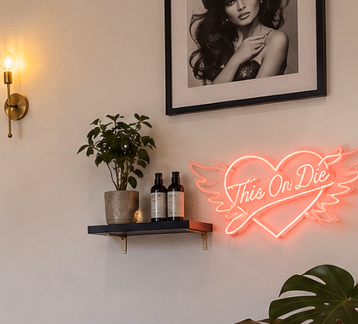 Professional hair products on the shelf at This Or Die Salon, beside the neon sign.